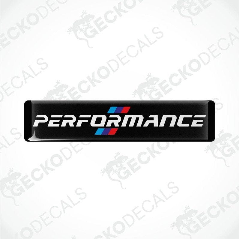 Black vinyl decals with 'PERFORMANCE' text and a red and blue emblem, indicative of BMW branding.