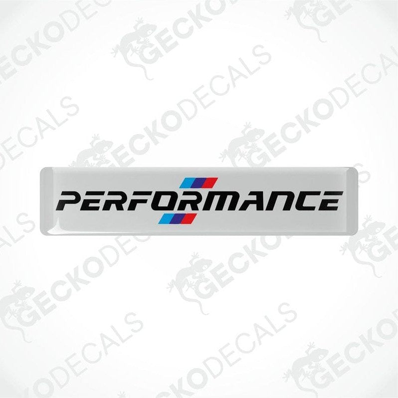 White vinyl decals with 'PERFORMANCE' text and a red and blue emblem, indicative of BMW branding.