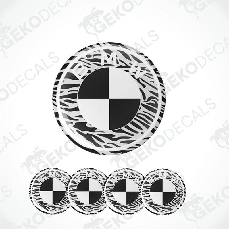 A set of four black, white, and black vinyl stickers with a BMW logo design.