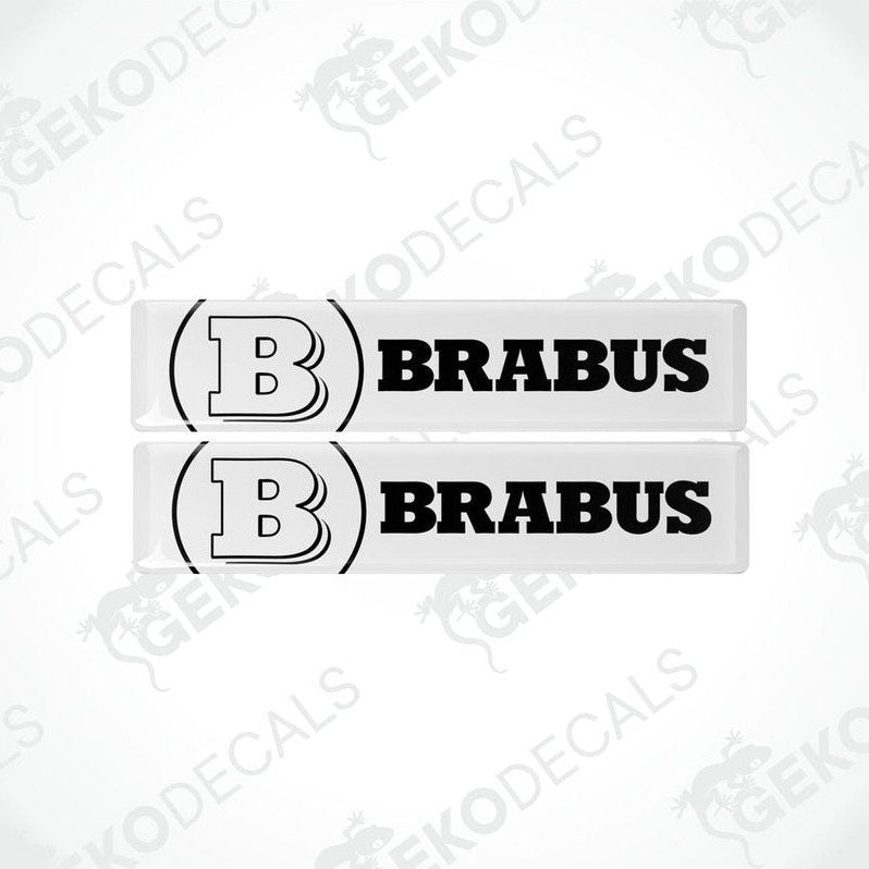 Two white and black vinyl decals with the BRABUS brand logo.