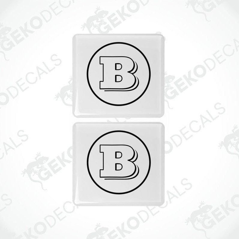 Two white vinyl stickers with a black 'B' in the center, placed against a white background with the text 'GeckoDecals'.
