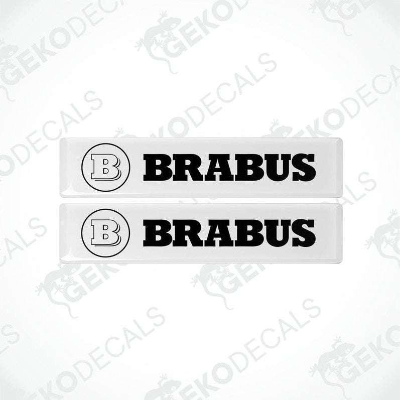 Two white and black rectangular BRABUS vinyl decals with a polyurethane coating.