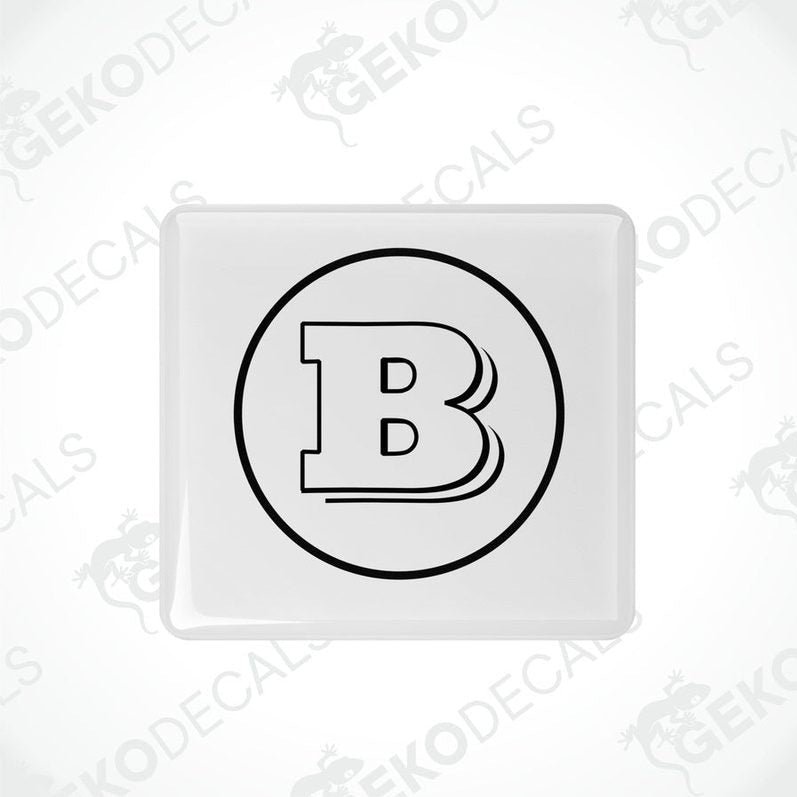 White vinyl stickers with a black 'B' in the center, placed against a white background with the text 'GeckoDecals'.