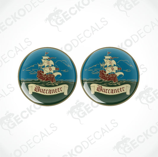 Two round epoxy decals with a pirate ship and the word 'Buccaneer' printed on them.