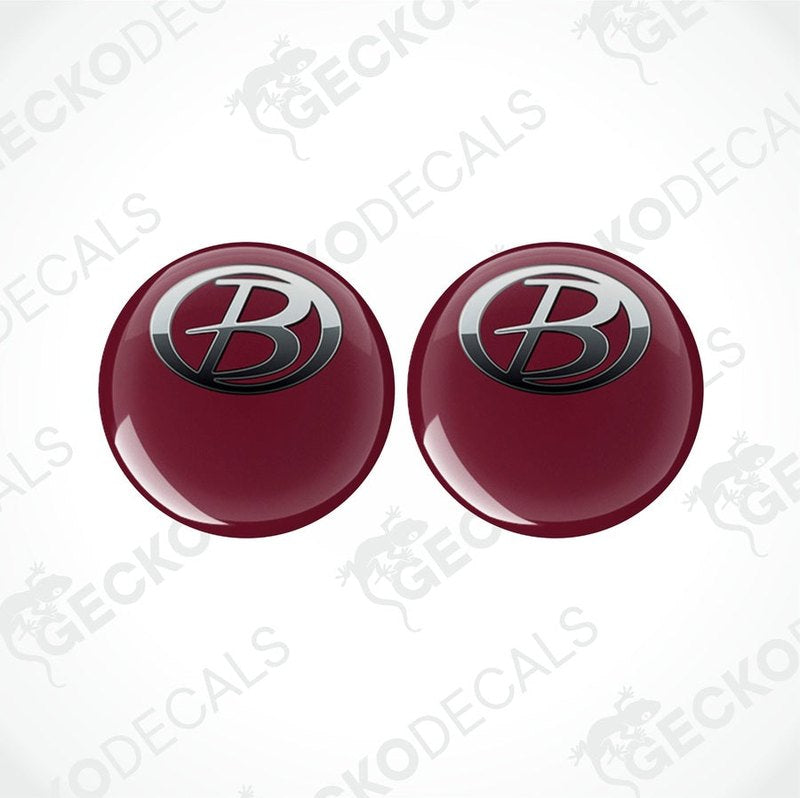 Two red vinyl stickers with a polyurethane coating, one with the Gecko Decals logo and the other with a different logo.