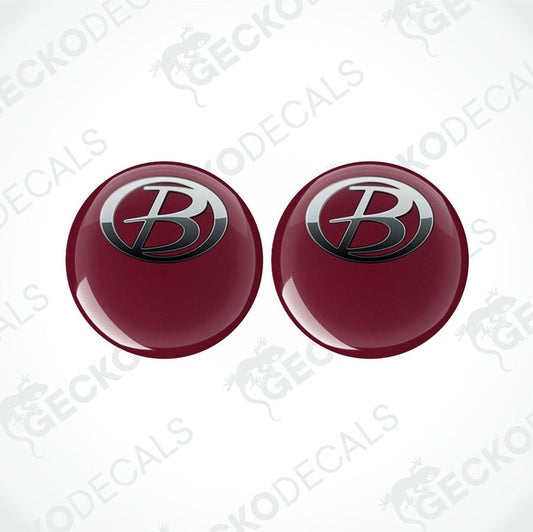 Two red vinyl stickers with a polyurethane coating, one with the Gecko Decals logo and the other with a different logo.