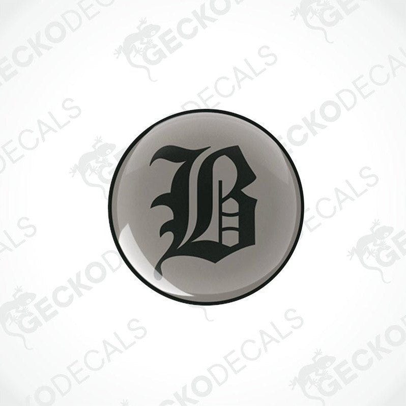 round black vinyl stickers with a large white 'B' in the center, placed against a white background with the text 'GECKODECALS'.