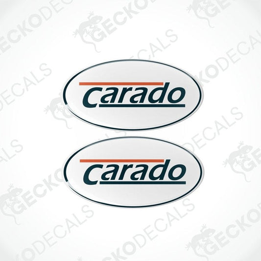Two oval-shaped 'Carado' branded decals with a white background, blue and orange text, and a gray dome sticker pattern.