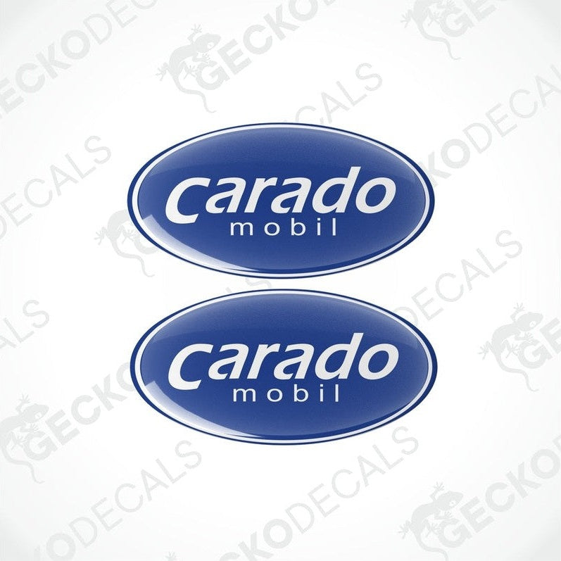 Two blue vinyl stickers with the word 'CARADO' printed on them.