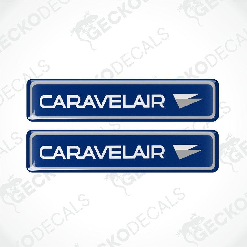 Two blue vinyl decals with the word 'CARAVELAIR' written in white and a red arrow symbol.