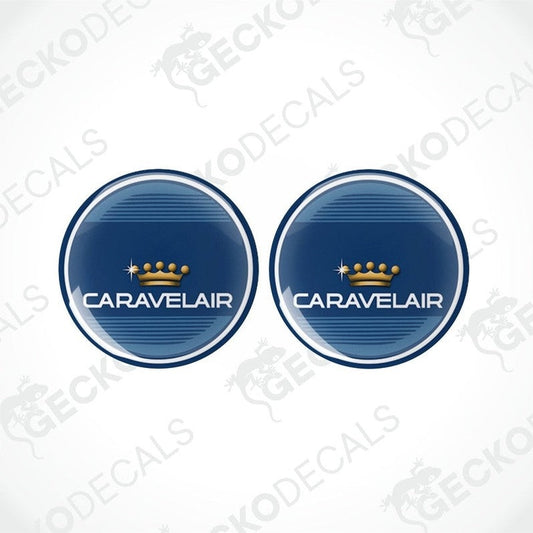 Two round blue vinyl decals with the text 'CARAVELAIR' and a crown symbol in white and gold.