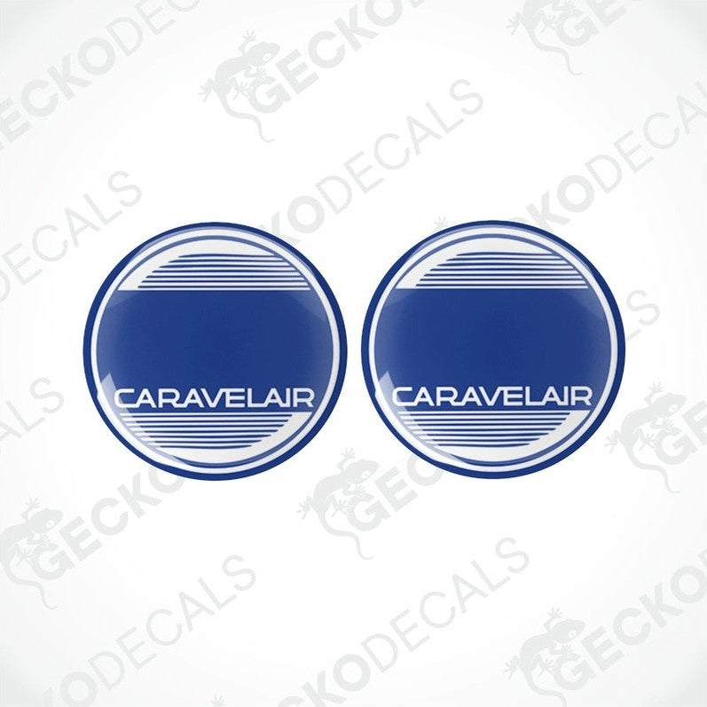 Two round blue vinyl decals with the text 'CARAVELAIR' on them, placed on a white background.