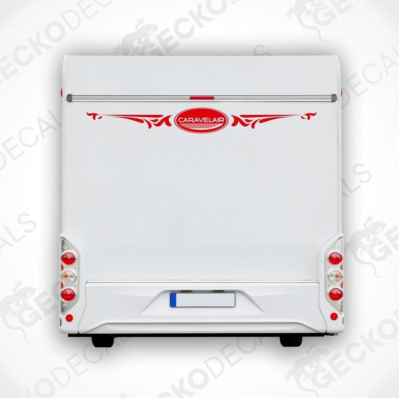 A white caravan rear with a red and white decorative decal applied on it.
