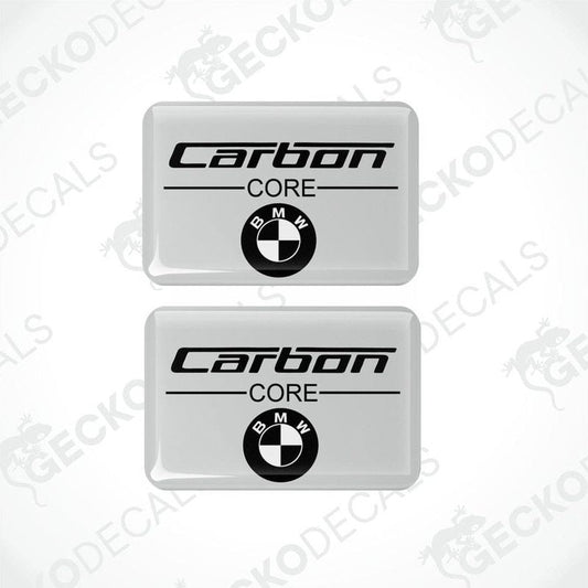 Two rectangular car decals with the words 'Carbon CORE' and the BMW logo