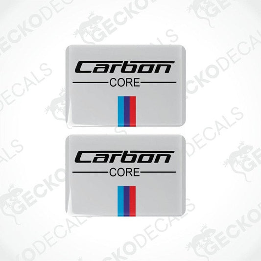 Two rectangular vinyl decals with 'Carbon CORE' text and a red and blue stripe on a white background.