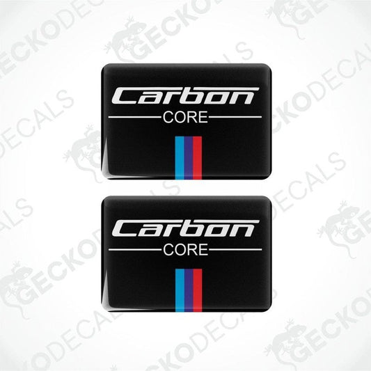 Two black vinyl stickers with the text 'CARBON CORE' and a horizontal stripe design in blue and red.