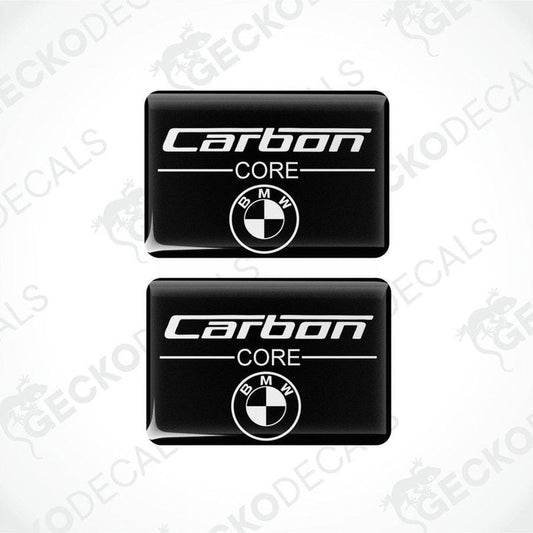 Two rectangular car decals with the words 'Carbon CORE' and the BMW logo