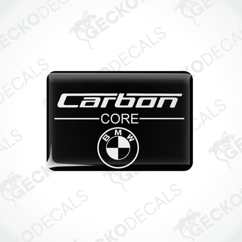 Rectangular car decals with the words 'Carbon CORE' and the BMW logo