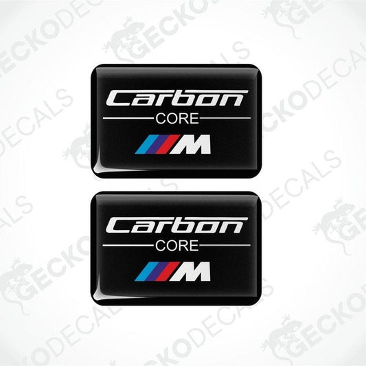 Two rectangular black car decals with the words 'Carbon Core' and the BMW 'M' logo in white and red.