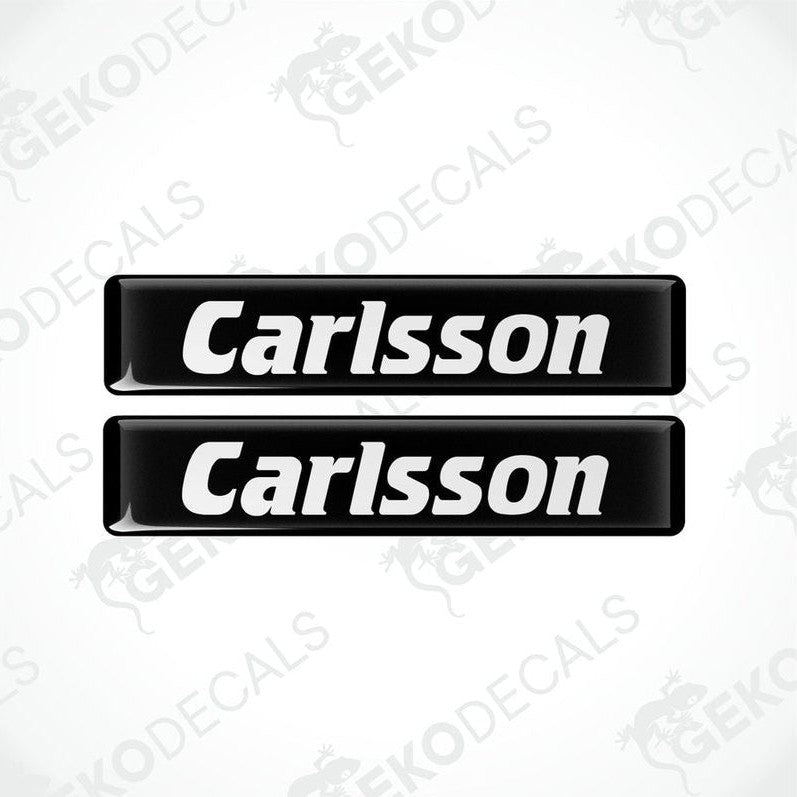 Two black rectangular car decals with the text 'Carlsson' in white.