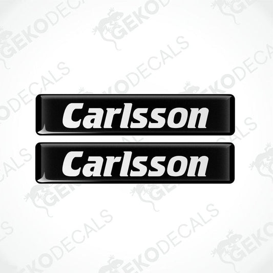 Two black rectangular car decals with the text 'Carlsson' in white.