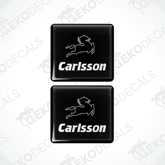 Two black rectangular car decals with the text 'Carlsson' in white.