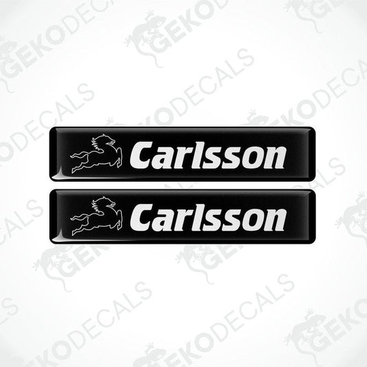 Two black vinyl decals with the text 'Carlsson' and a logo on them.