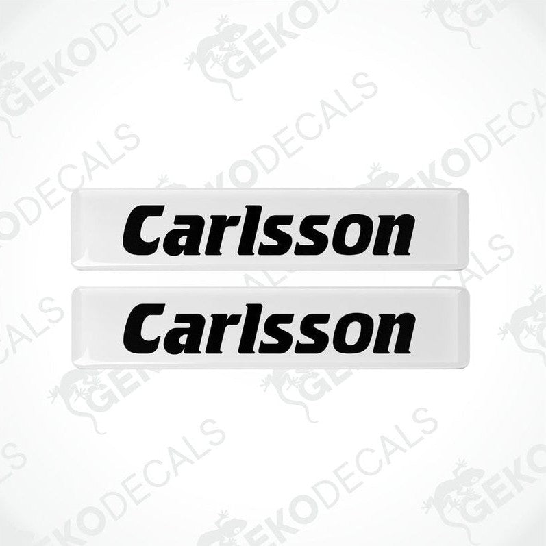 Two white rectangular car decals with the text 'Carlsson' in black.