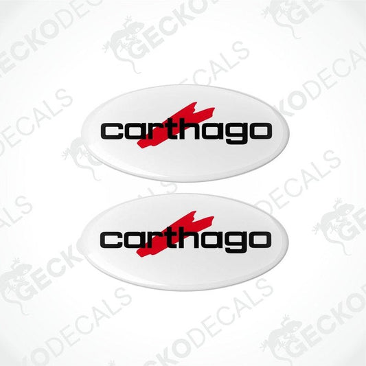 Two white vinyl stickers with the red text 'CARTHAGO' and a black logo symbol on them.