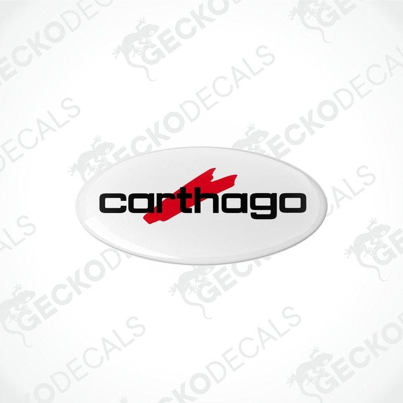 Two white vinyl stickers with the red text 'CARTHAGO' and a black logo symbol on them.