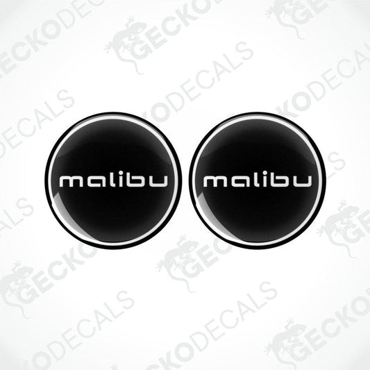 Two round black vinyl decals with the word 'malibu' written in white letters.