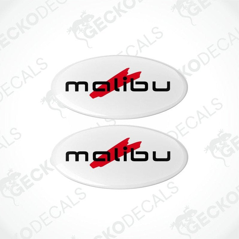 Two white oval-shaped epoxy decals with the text 'malibu' and a red arrow on them.