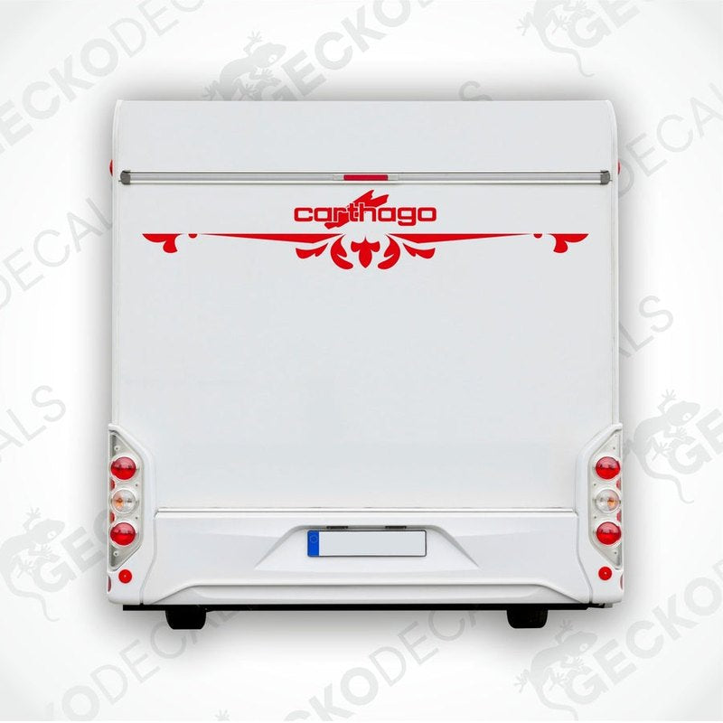 A white rear decal with red text and decorative elements, resembling a logo, on a white surface likely representing the back of a vehicle.