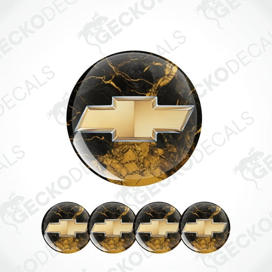 Gold Chevrolet logo on black marble patterned background