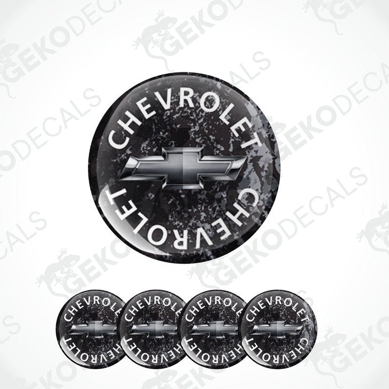 A set of four black vinyl stickers with the word 'CHEVROLET' and the Chevrolet logo on them.