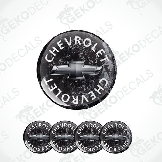 A set of four black vinyl stickers with the word 'CHEVROLET' and the Chevrolet logo on them.