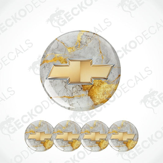
A three-dimensional gold metallic Chevrolet logo with a thin silver border on a golden light gray marble background epoxy decal set