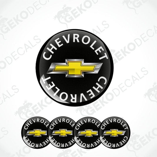 A set of vinyl decals with the Chevrolet logo, including one large emblem and four smaller ones, with a black background and yellow and silver detailing.