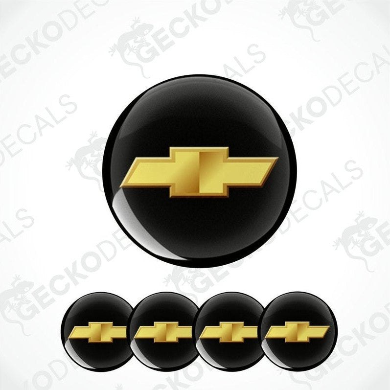 A set of four black vinyl stickers with a gold Chevrolet logo, designed for use on car decals.
