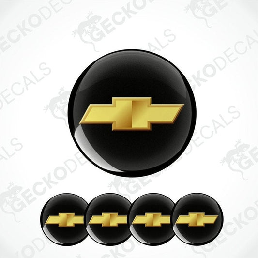 A set of four black vinyl stickers with a gold Chevrolet logo, designed for use on car decals.