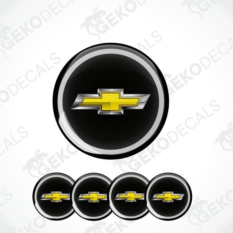 A set of four round vinyl decals with a Chevrolet logo design, with a black background and yellow Chevrolet logo on each decal.