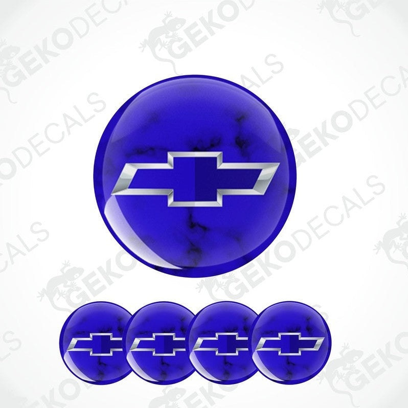 A set of four blue vinyl stickers with a Chevrolet logo, designed for use on car wheels or caps.