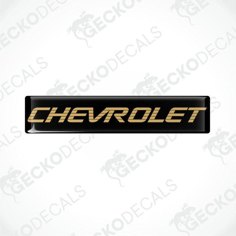 Black vinyl stickers with the word 'CHEVROLET' in gold lettering, placed against a white background.