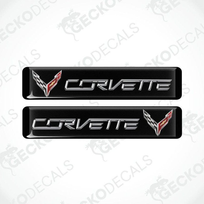Two black vinyl stickers with the word 'CORVETTE' and a graphical design in red and white.