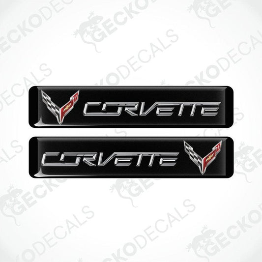 Two black vinyl stickers with the word 'CORVETTE' and a graphical design in red and white.