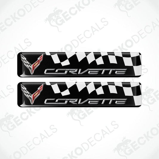 A pair of black, white, and red vinyl decals with a polyurethane coating featuring the Chevrolet Corvette logo.