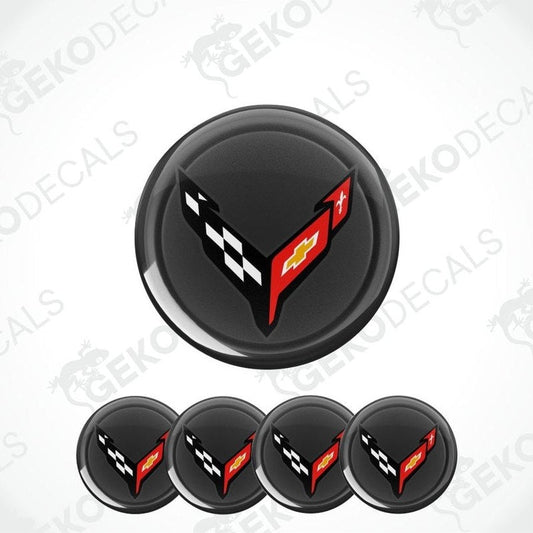 Black round decal with a red and white logo on a white background