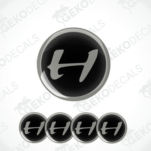 A set of four black vinyl stickers with the word 'HENNESSEY' designed in a specific font and arranged in a spiral pattern.