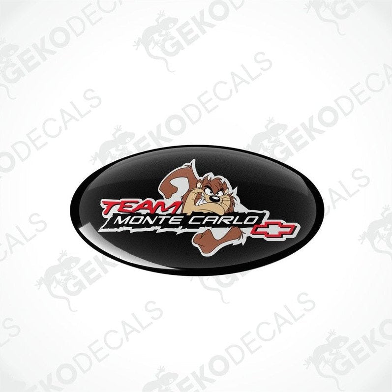 Two round vinyl stickers with a team monte carlo logo, predominantly black with red and white text and a cartoonish character.
