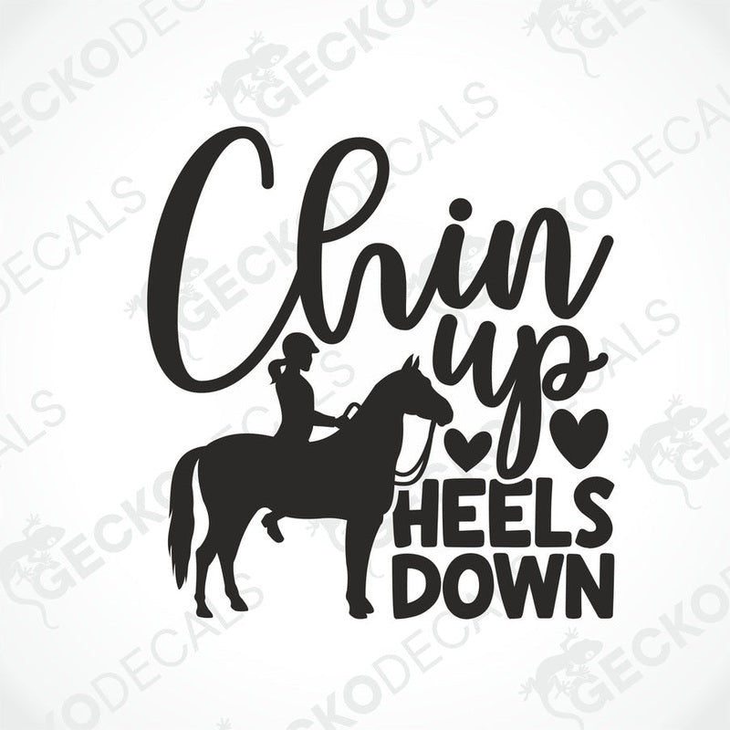A black and white die cut decal with the text 'CHIN UP HEELS DOWN' and an illustration of a person riding a horse.
